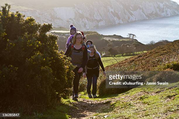 two women and babies walking on coastal - s0ulsurfing stock pictures, royalty-free photos & images