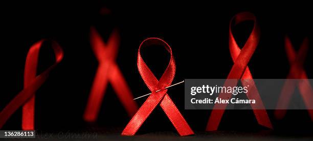 world day of aids - aids ribbon fotografías e imágenes de stock