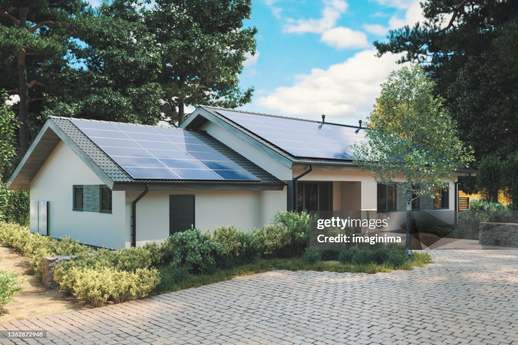 Energy Efficient House With Solar Panels And Wall Battery For Energy Storage