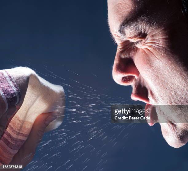 man sneezing - covering nose stock pictures, royalty-free photos & images