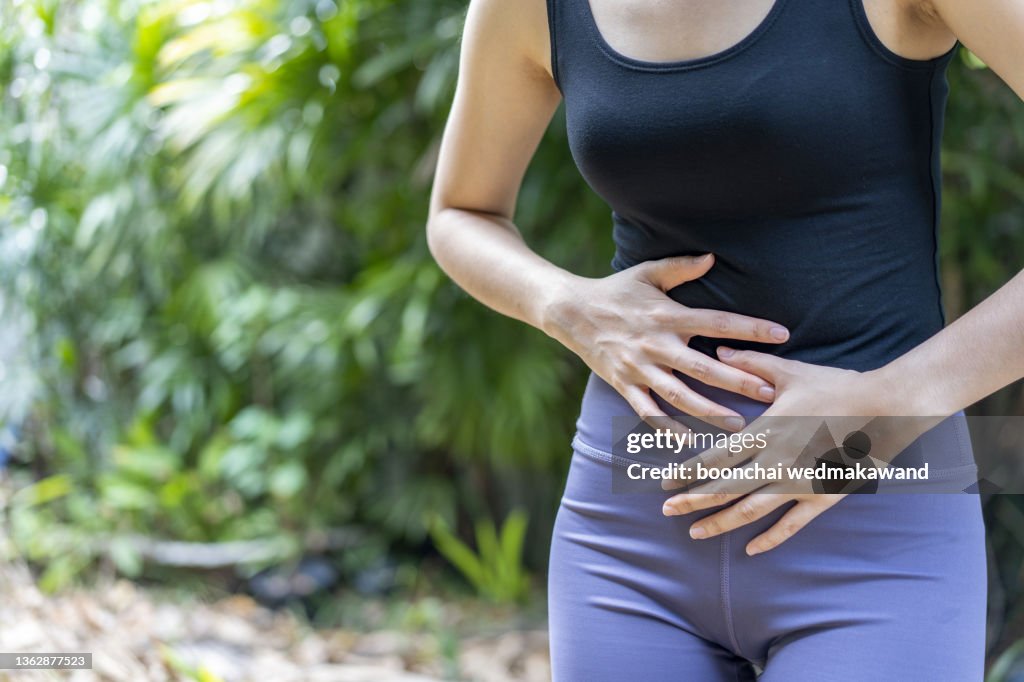 Woman with stomach ache, menstrual period cramp, abdominal pain, food poisoning