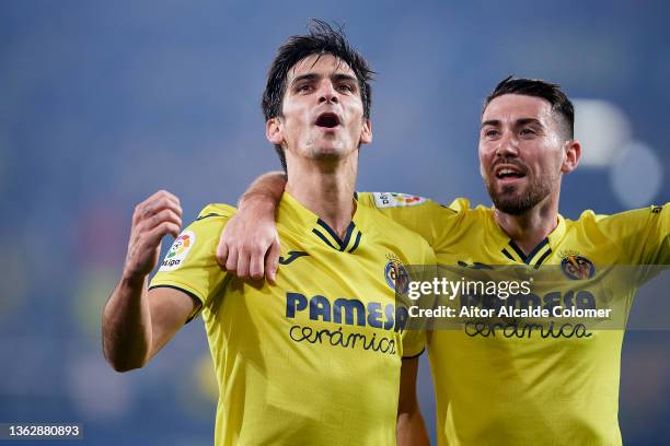 Gerard Moreno of Villarreal CF celebrates their side's third goal with teammate Moi Gomez during the LaLiga Santander match between Villarreal CF and...