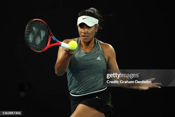 Destanee Aiava of Australia plays a forehand in her match against Simona Halep of Romania during day three of the Melbourne Summer Events at...