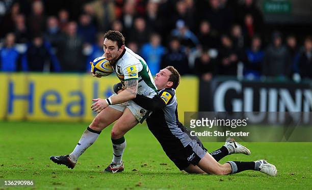 Saints flyhalf Ryan Lamb is tackled by Jimmy Gopperth of the Falcons during the Aviva Premiership match between Newcastle Falcons and Northampton...
