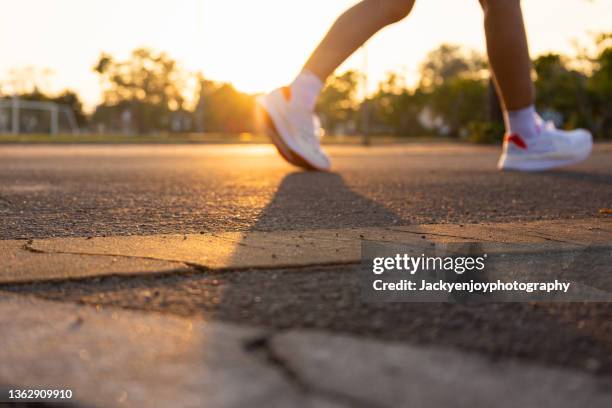 running at sunset - all weather running track fotografías e imágenes de stock