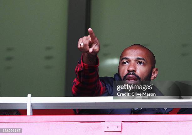 Former Arsenal player Thierry Henry of the New York Red Bulls is seen in the grandstand during the Barclays Premier League match between Arsenal and...