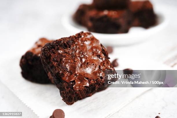 homemade fudge brownies,close-up of chocolate cake on table - brownie stockfoto's en -beelden