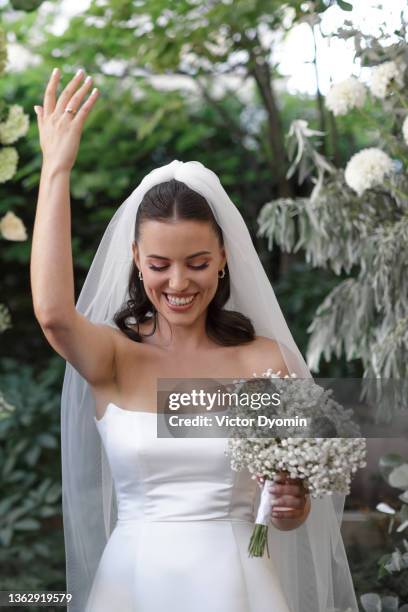 happy stylish bride with the wedding bouquet - noiva imagens e fotografias de stock
