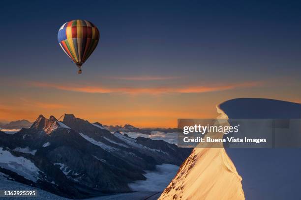 hot air balloon over mountains - bernese alps stock pictures, royalty-free photos & images