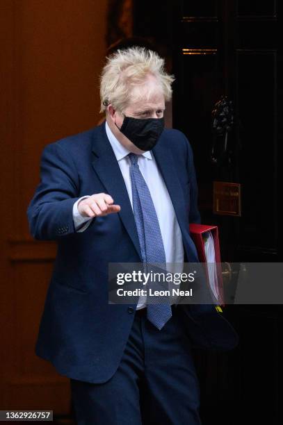 Britain's Prime Minister Boris Johnson leaves number 10, Downing Street ahed of the weekly PMQ session in the House of Commons on January 05, 2022 in...