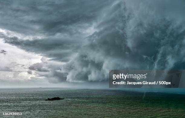scenic view of sea against storm clouds,tanjung bungah,penang,malaysia - monzón fotografías e imágenes de stock