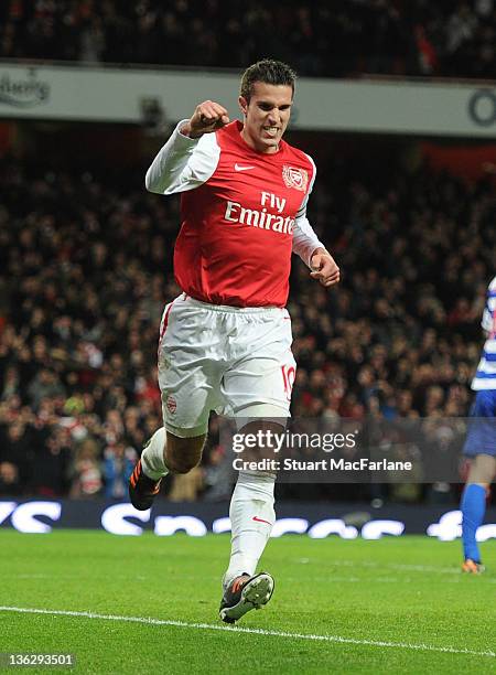 Robin van Persie celebrates scoring the Arsenal goal during the Barclays Premier League match between Arsenal and Queens Park Rangers at Emirates...