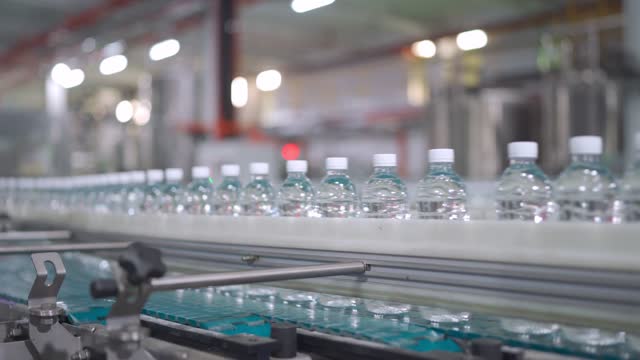 mineral water Factory production line at finishing line in a row moving queuing for labelling packing