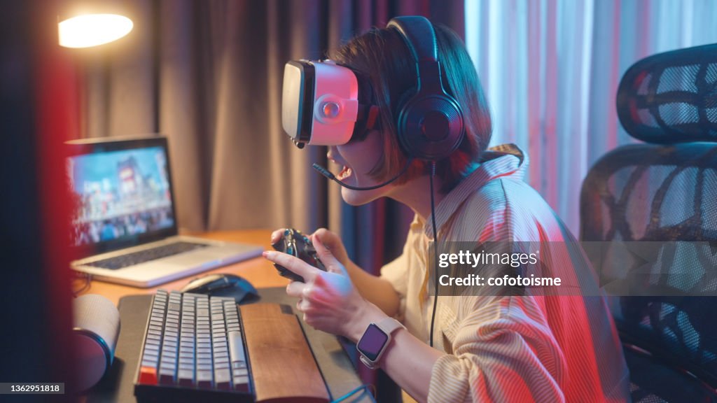 Virtual reality gaming and Metaverse concept, women have fun playing VR games at home