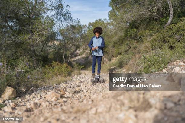 boy playing with remote control prototype car - remote control car stock pictures, royalty-free photos & images