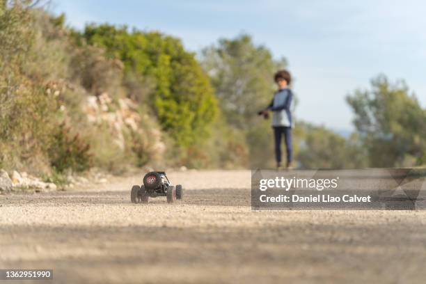 unrecognizable boy playing with a prototype radio controlled car - remote control car stock pictures, royalty-free photos & images