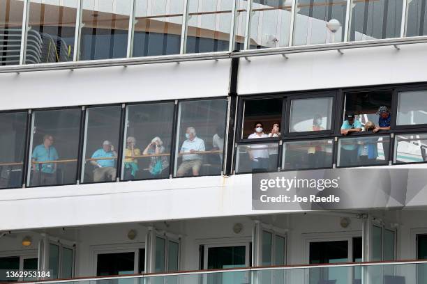 Passengers wait on the Norwegian Pearl as it docks at PortMiami on January 05, 2022 in Miami, Florida. The cruise ship was on an 11-day voyage...