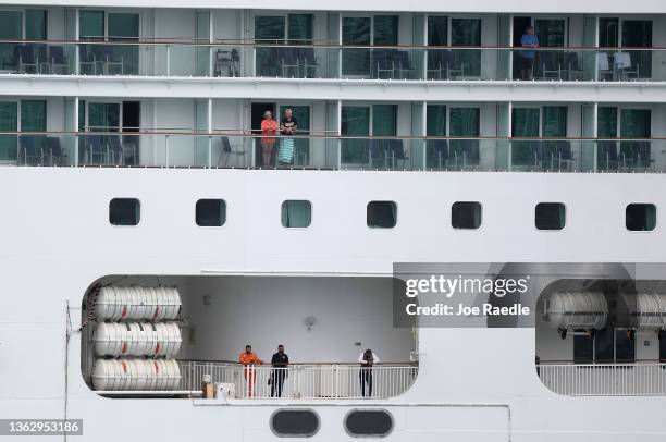 Passengers wait on the Norwegian Pearl as it docks at PortMiami on January 05, 2022 in Miami, Florida. The cruise ship was on an 11-day voyage...