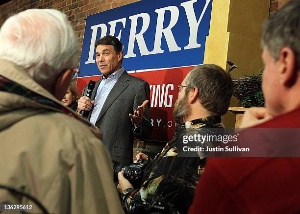 Republican presidential hopeful Texas governor Rick Perry speaks during a campaign stop at Bloomers on Central Gourmet Coffee and Gift Shoppe on...