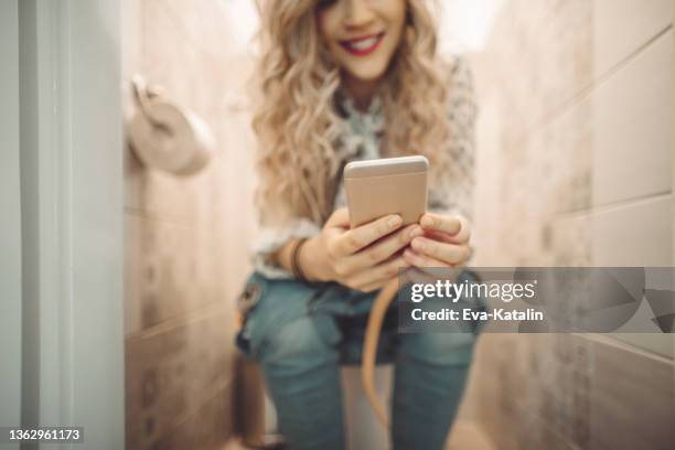 young woman at home - men taking a dump stock pictures, royalty-free photos & images