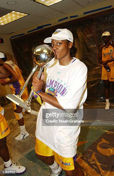 Nikki Teasley of the Los Angeles Sparks celebrates in the lockerroom after winning the WNBA Championship against the New York Liberty after Game 2 of...