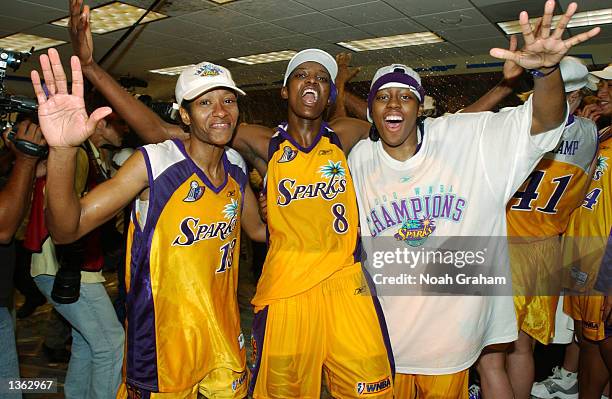 Sophia Witherspoon Delisha Milton and Nikki Teasley of the Los Angeles Sparks celebrates in the lockerroom after winning the WNBA Championship...