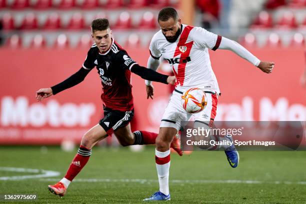 Iago Lopez of CD Mirandes compete for the ball with Tiago Manuel Dias 'Bebe' of Rayo Vallecano during the round of 32 of the Copa del Rey match...