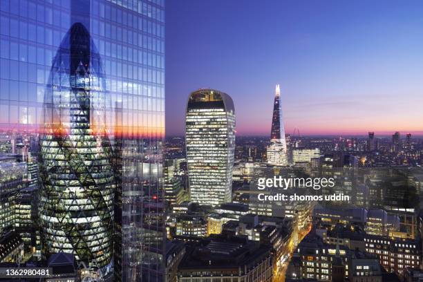 composite of london city skyline at dusk - elevated view - banker doppelbelichtung stock-fotos und bilder