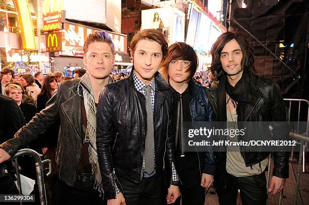 Nash Overstreet, Ryan Follese, Jamie Follese and Ian Keaggy of Hot Chelle Rae pose during Dick Clark's New Year's Rockin' Eve with Ryan Seacrest 2012...