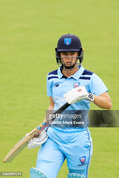 Phoebe Litchfield of the Breakers walks off after being caught off the bowling of Chloe Rafferty of the Meteors during the WNCL match between ACT...