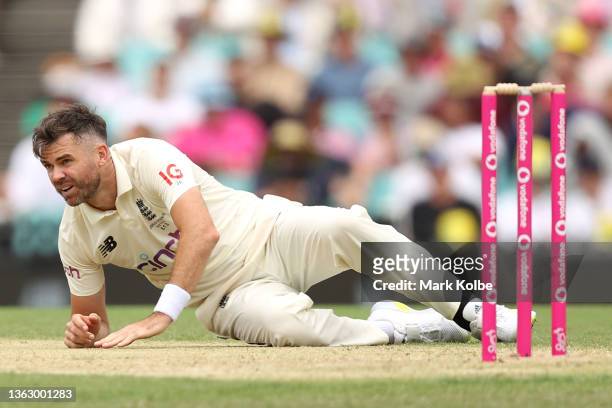 James Anderson of England falls after bowling during day two of the Fourth Test Match in the Ashes series between Australia and England at Sydney...