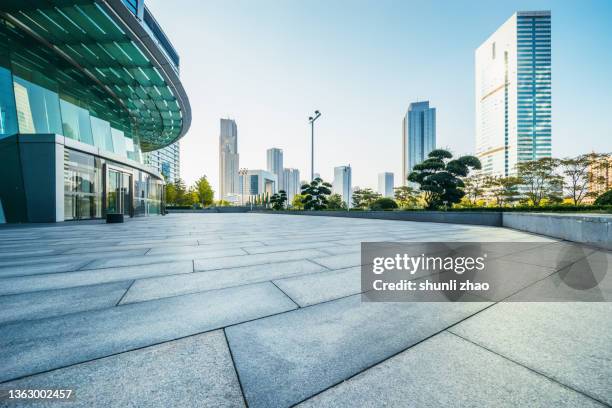 empty square outside an office building - glass building road stock pictures, royalty-free photos & images