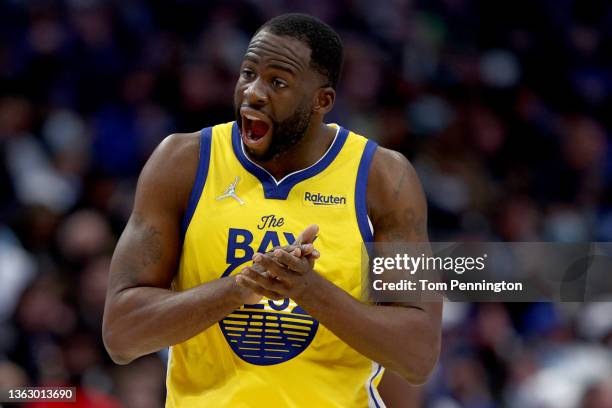 Draymond Green of the Golden State Warriors reacts after being fouled by the Dallas Mavericks in the third quarter at American Airlines Center on...