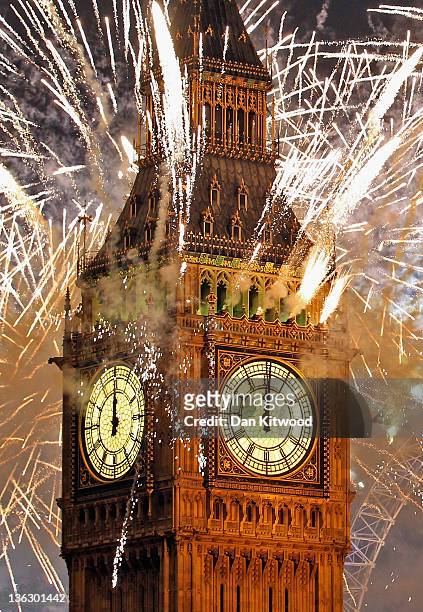 Fireworks light up the London skyline and Big Ben just after midnight on January 1, 2012 in London, England. Thousands of people lined the banks of...