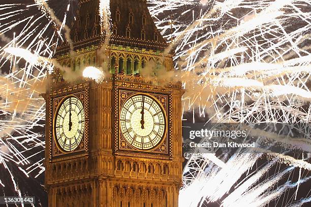 Fireworks light up the London skyline and Big Ben just after midnight on January 1, 2012 in London, England. Thousands of people lined the banks of...