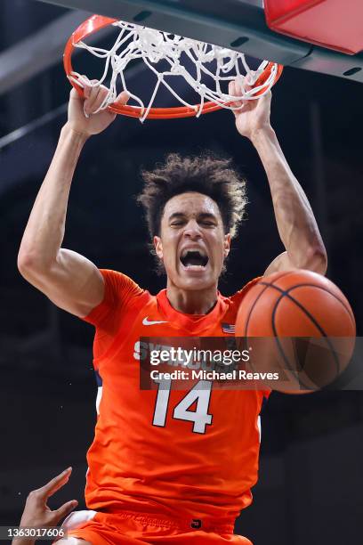 Jesse Edwards of the Syracuse Orange dunks against the Miami Hurricanes during the second half at Watsco Center on January 05, 2022 in Coral Gables,...
