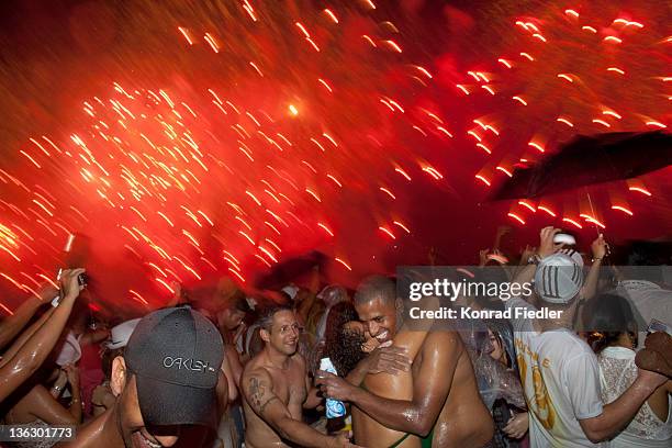 Brazilians celebrate at the annual New Year's Eve beach party on December 31, 2011 for the Copacabana Reveillon in Rio De Janeiro, Brazil. One of the...