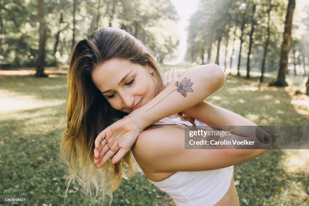 Candid of a woman looking down with her arms crossed in her chest