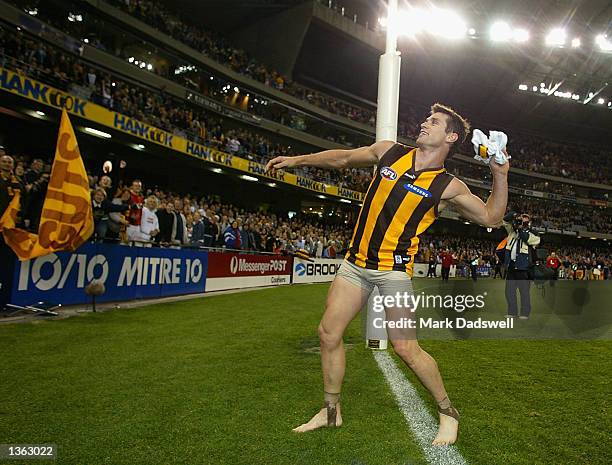 Shane Crawford for the Hawks throws his shorts into the Hawthorn cheer squad after the teams win in the round 22 AFL match between the Geelong Cats...