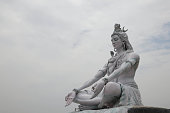 RISHIKESH, INDIA , Statue of Shiva, Hindu idol near Ganges River water, Rishikesh, India. The first Hindu God Shiva. Sacred places for pilgrims in Rishikesh