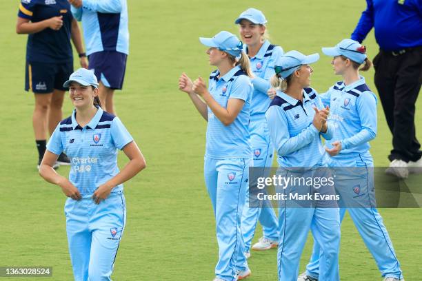 Stella Campbell of the Breakers is clapped off the pitch after taking seven wickets during the WNCL match between ACT Meteors and NSW Breakers at...