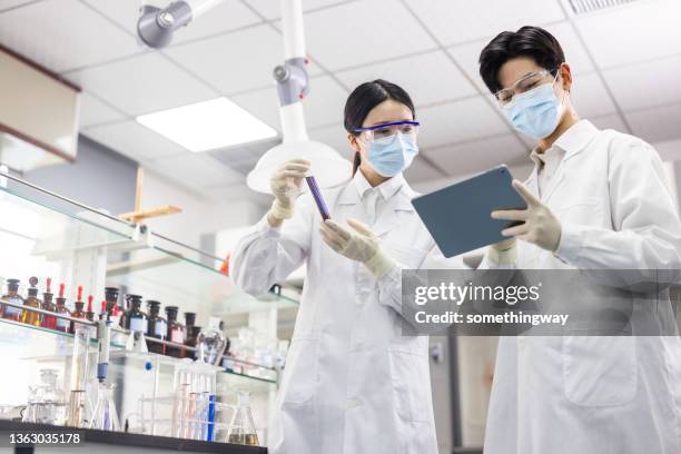 scientists are working at chemical lab. - chinese scientist stock pictures, royalty-free photos & images