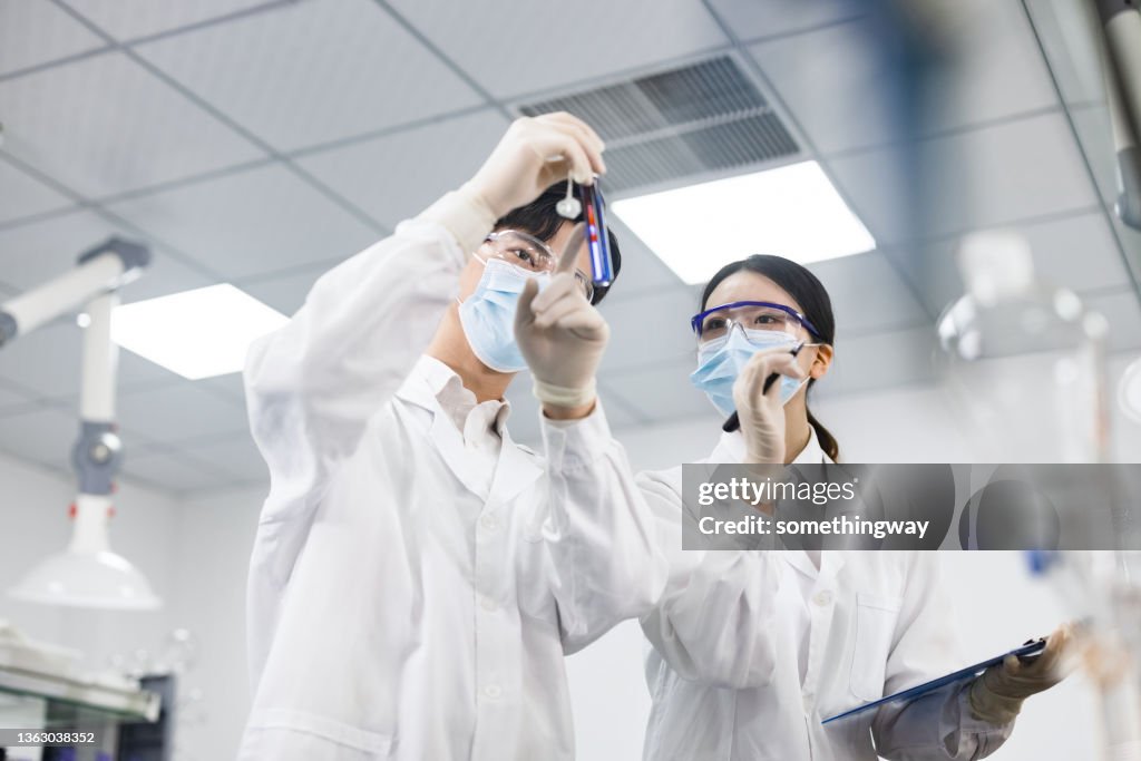 Scientists are working at chemical lab.