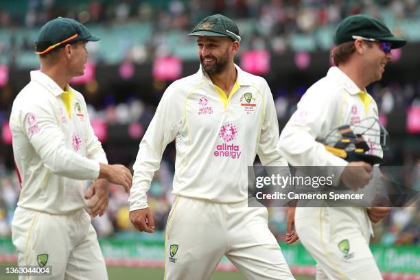 David Warner, Nathan Lyon and Marcus Harris of Australia leave the field at the completion of play during day two of the Fourth Test Match in the...