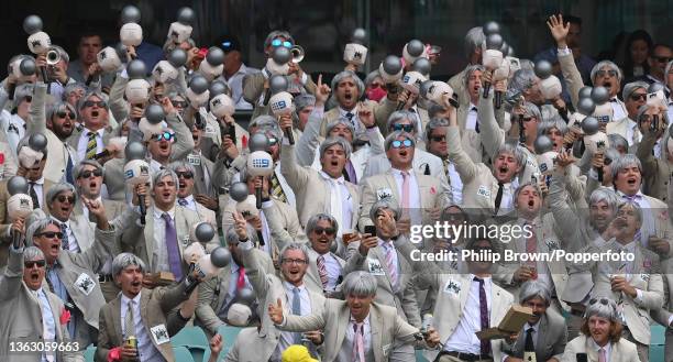 Group of spectators dressed as Richie Benaud cheer during day two of the Fourth Test Match in the Ashes series between Australia and England at...