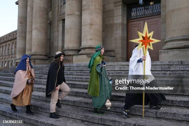 Carolers dressed as the Three Kings are seen prior to the annual Three Kings Day of the FDP on January 06, 2022 in Stuttgart, Germany. The gathering...