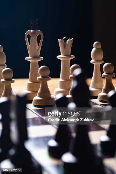 a game and a chess competition. placed pawns on a black and white board. the beginning of the game. the concept of thinking, leadership and strategy in business. intellectual leisure, corporate entertainment. - checking sports stock pictures, royalty-free photos & images