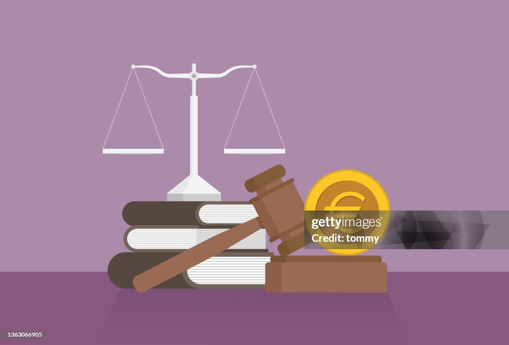 Equal-arm balance, a book, a gavel, and a Euro coin on a table