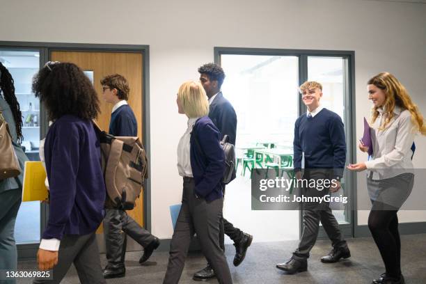 cheerful secondary school students leaving class - school students uniform walking stock pictures, royalty-free photos & images