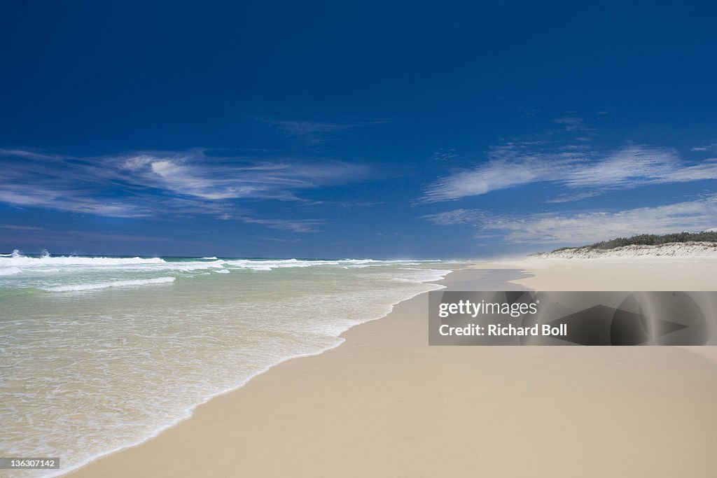 An empty sandy beach on Fraser Island, Australia.